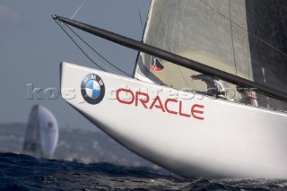 Bow of BMW Oracle leaping off a wave