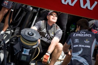 Mainsheet winch trimmer on Team New Zealand wearing sunglasses