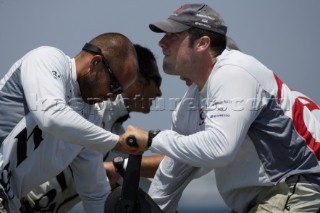 Crew teamwork for the grinders of the winches onboard Alinghi