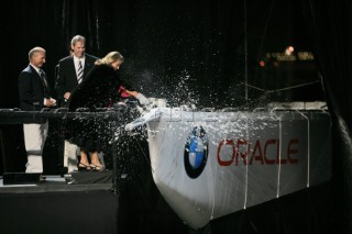 BMW ORACLE Racing - USA87 Christening *** BMW ORACLE Racing - USA87 Christening. Champagne bottle broken on the bow at the yachts launch ceremony.
