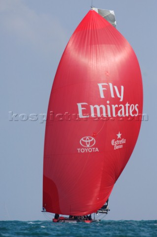 Emirates Team New Zealand NZL84 with red spinnaker flying in leg two of race five of the Louis Vuitt