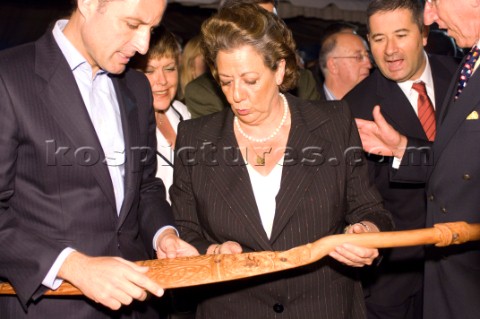 Rita Barbera Mayor of Valencia admires the ceremonial paddle presented by Auckland Mayor Dick Hubbar