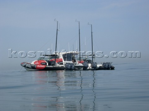 Emirates Team New Zealand weather boats sit on a glassy mediteranean Day four of the Louis Vuitton C