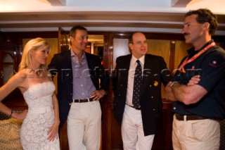 VALENCIA, SPAIN - May 14th: Americas Cup yachtsman Paul Cayard (USA right) who is presently representing Desafio Espanol, meets with HRH Prince Albert of Monaco (2nd right), Ernesto Bertarelli owner of Alinghi (3rd right) and his wife Kirsten, onboard the classic yacht Tuiga at the exclusive Tuiga Party during the Louis Vuitton Cup Semi Finals.