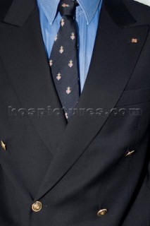 Man dressed in jacket and tie yacht club uniform