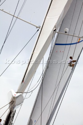 The bowman on Hamilton II inspects the genoa battens sailing on Astilleros di Majorca Day of the Sup