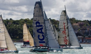 COWES, ENGLAND - August 13th: Alfa Romeo (NZ) leads ICAP Leopard 3 (UK) and the fleet of nearly 300 racing yachts leaving Cowes on the Isle of Wight to begin the 605 mile Rolex Fastnet Race on August 13th 2007. The yachts race to the Fastnet Rock off southern Ireland and back to the finish in Plymouth, England.