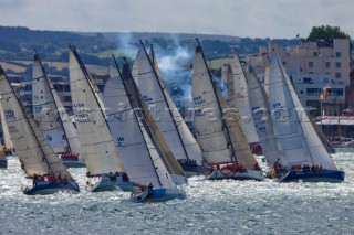 COWES, ENGLAND - August 13th: The fleet of nearly 300 racing yachts leaves Cowes on the Isle of Wight to begin the 605 mile Rolex Fastnet Race on August 13th 2007. The yachts race to the Fastnet Rock off southern Ireland and back to the finish in Plymouth, England.