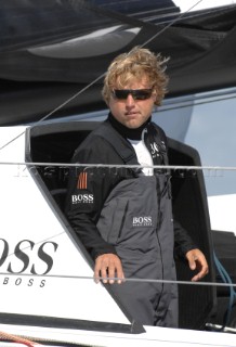 COWES, ENGLAND - August 13th: Alex Thompson on the Open 60 Hugo Boss (UK)  Rolex Fastnet Race 2007