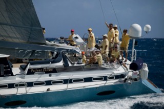 The yellow dressed crew of Patient Falcon - The Superyacht Cup 2007 Antigua in the Caribbean