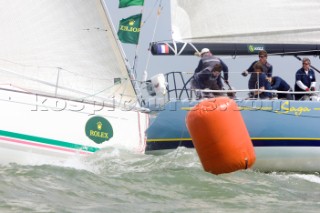 COWES, UK - July 1st: The French racing yacht Saga is hit from astern at the leeward mark on Day 2 of the Rolex Commodores Cup held in Cowes, Isle of Wight. The English Team take the overall lead from the French Blue Team who presently hold second place. The Rolex Commodores Cup is held biannually in the UK and is the premier team racing event in the UK for big racing yachts. It is run by the Royal Ocean Racing Club. (Photo by Mike Jones/kospictures.com).