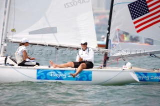 Qingdao, China, 20080807: 2008 OLYMPICS - Practice Race at Olympic Sailing Regatta before the real deal begins on Saturday. Sally Barkow - right - (USA) - Yngling Class.  (No sale to Denmark)