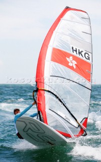 Qingdao, China, 20080811: 2008 OLYMPICS - third day of racing in the Olympic Sailing Event. Wai Kei Chan (HKG) -  RS:X Class.  (no sale to Denmark)