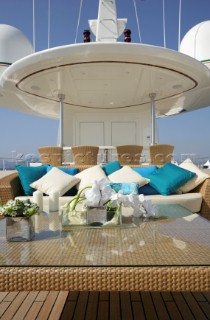 Superyacht deck sun lounger and sofa relaxation area