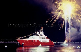 Lanscape of the build and launch party ceremony from a slipway of the red superyacht Elix