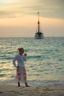 Girl on beach whilst cruising Malaysia on the tradional yacht Silolona