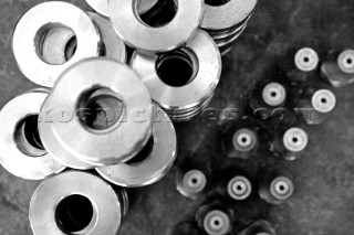 Yacht builders and skilled workers boatbuilding at the Cheoy Lee shipyard and boatbuilders in China. Detail of washers.