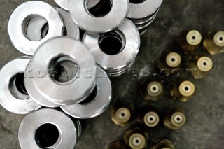 Yacht builders and skilled workers boatbuilding at the Cheoy Lee shipyard and boatbuilders in China. Detail of washers.