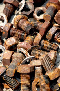 Yacht builders and skilled workers boatbuilding at the Cheoy Lee shipyard and boatbuilders in China. Detail of nuts and bolts.