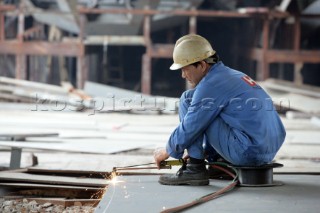 Yacht builders and skilled workers boatbuilding at the Cheoy Lee shipyard and boatbuilders in China
