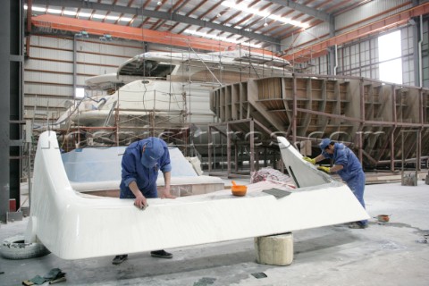 Yacht builders and skilled workers boatbuilding at the Double Happiness shipyard and boatbuilders in