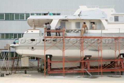 Yacht builders and skilled workers boatbuilding at the Jet tern shipyard and boatbuilders in China