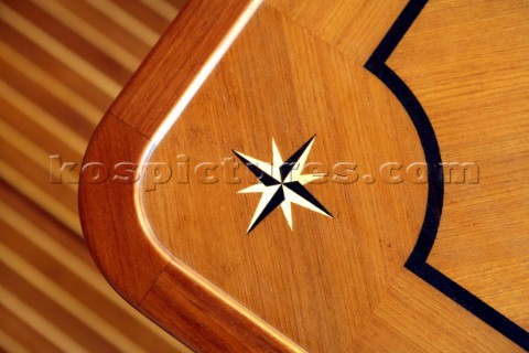 Wooden inlaid table detail on superyacht during boatbuilding at the Jet tern shipyard and boatbuilde