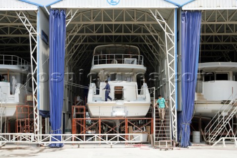 Yacht builders and skilled workers boatbuilding at the Jet tern shipyard and boatbuilders in China