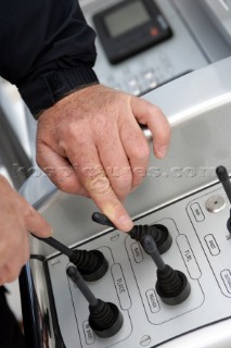Operating electronic instrument controls onboard the sailing superyacht YII Y2 near San Remo