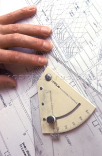 Yacht designer and naval architect tools of the trade set square on drawing board