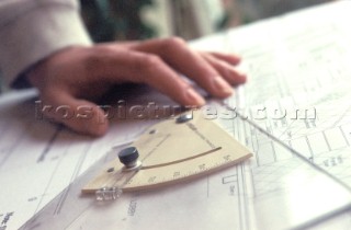 Yacht designer and naval architect tools of the trade set square on drawing board