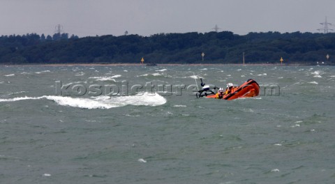 Skandia Cowes Week 2008  RNLI Inshore Lifeboat coming to the rescue of the Extreme 40 BMW Oracle Rac