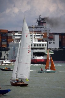 Skandia Cowes Week 2008 - Commercial container ship moves through traffic and navigation congestion in confined waters of the Solent. Potential collisions are common.