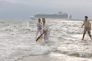 THE SOLENT, UK - August 31st: For a briefÊspellÊonce each summer on the lowest of spring tides, members of the Island Sailing Club and Royal Southern Yacht Club sail outÊto The Brambles sand bank in the middle of The Solent andÊplay cricket, before the tide rushes back in one hour later.ÊThe fixture was first started in the 1950Õs by the late Uffa Fox, a sailing companion of the Duke of Edinburgh, the Royal Southern and the Island Sailing Club compete every year. As soon as the sandbank appears the stumps are put up and the match gets under way. Many of the competitors dress all in cricket whites and ÔThe Bramble InnÕ is erected to serve drinks to spectators. The Bramble Inn is one of the most bizarre pubs in England: it is in the middle of the sea and exists only for about an hour each year.