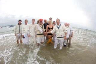 THE SOLENT, UK - August 31st: For a briefÊspellÊonce each summer on the lowest of spring tides, members of the Island Sailing Club and Royal Southern Yacht Club sail outÊto The Brambles sand bank in the middle of The Solent andÊplay cricket, before the tide rushes back in one hour later.ÊThe fixture was first started in the 1950Õs by the late Uffa Fox, a sailing companion of the Duke of Edinburgh, the Royal Southern and the Island Sailing Club compete every year. As soon as the sandbank appears the stumps are put up and the match gets under way. Many of the competitors dress all in cricket whites and ÔThe Bramble InnÕ is erected to serve drinks to spectators. The Bramble Inn is one of the most bizarre pubs in England: it is in the middle of the sea and exists only for about an hour each year.