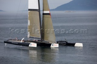 ANACORTES, WA - SEPTEMBER 2: The new BMW Oracle trimaran commissioned by Larry Ellyson and helmed and skippered by Russell Coutts touches the water and undergoes preliminary sailing trials following its build in total secrecy in a shipyard in Anacortes, USA. The yacht is 90ft long and 90ft wide with a mast of 158ft. It has been built to race the Swiss defender Alinghi in the 33rd Americas Cup. It is probably the fastest and most powerful multihull ever built.