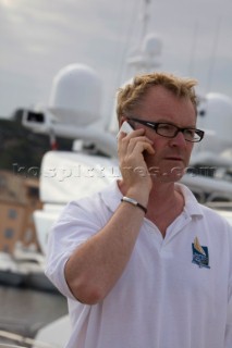Crew using mobile telephone communication onboard superyacht  - MODEL RELEASED -