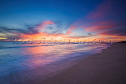 Colourful sunset over a sandy beach
