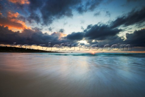 Colourful sunset over a sandy beach