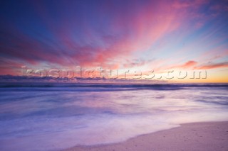 Colourful sunset on a perfect sandy beach