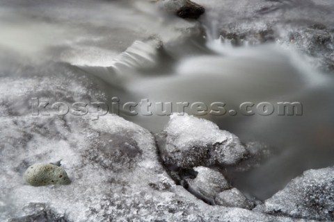 A slow exposure of a stream on a thawing glacier Skaftafell National Park Iceland