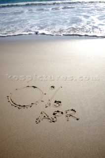 Zero percent APR 0% sign writing message on a sandy beach in Tarifa, Spain, near Gibraltar.