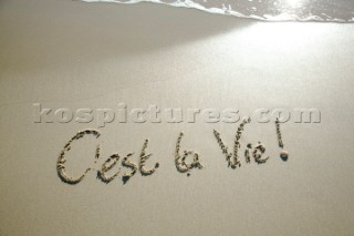 Cest La Vie its life sign writing message on a sandy beach in Tarifa, Spain, near Gibraltar.