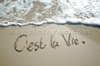 Cest La Vie its life sign writing message on a sandy beach in Tarifa, Spain, near Gibraltar.
