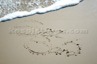 Sea Sand sign writing message on a sandy beach in Tarifa, Spain, near Gibraltar.