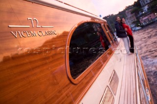 A romantic couple relaxing onboard a Vicel 72 classic motor yacht.  Model Released.