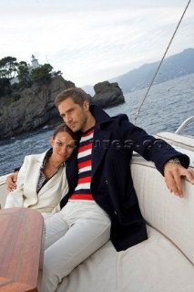 Lifestyle couple onboard a Vicem 72 classic motor yacht Model Released.