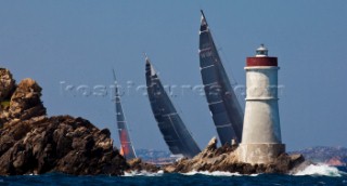 Maxi Yacht Rolex Cup 2009 Fleet at Capo Testa Lighthouse.WALLY 130, Sail n: W - 130, Nation: MON, Owner: Luca Bassani Antivari, Model: wally 130,VISIONE, Sail n: GER 5200, Nation: GER, Owner: Hasso Plattner, Model: baltic 147,ROMA - ANIENE, Sail n: ITA 535, Nation: ITA, Owner: C.C.Aniene / F.Faruffini