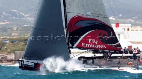 Emirates Team New Zealand pounds to windward mark three in the coastal race of the Trophy of Portuga