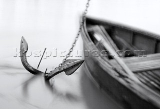 Rowing boat with anchor and chain